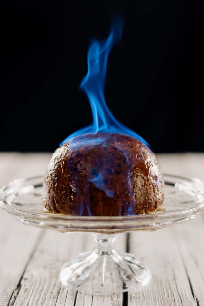 The flaming plum pudding was photographed by Ben Welland with camera and fire extinguisher in hand at Thyme & Again Creative Catering and Take Home Food Shop in Ottawa's Wellington West neighbourhood.